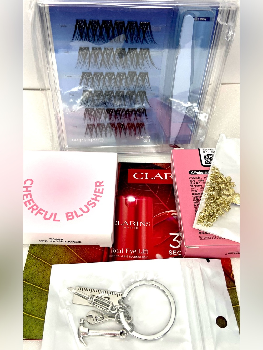 6 items Clarins Red and Pink Cosmetic Keychain Gift Set